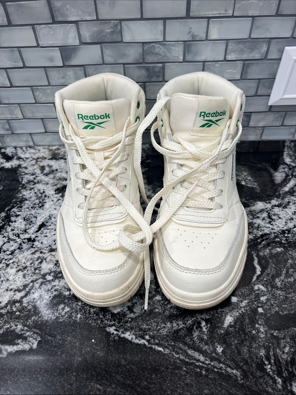 Reebok Women’s Cream High-Top Sneakers with Green Logo Accents